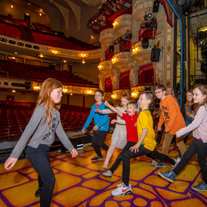 Children on stage for CCLASP visit