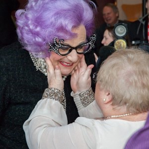 Dame Edna saying hello to a customer