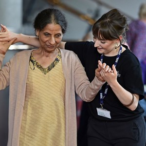 A Capital Theatres staff member dancing with a participant in our dementia friendly Tea Parties