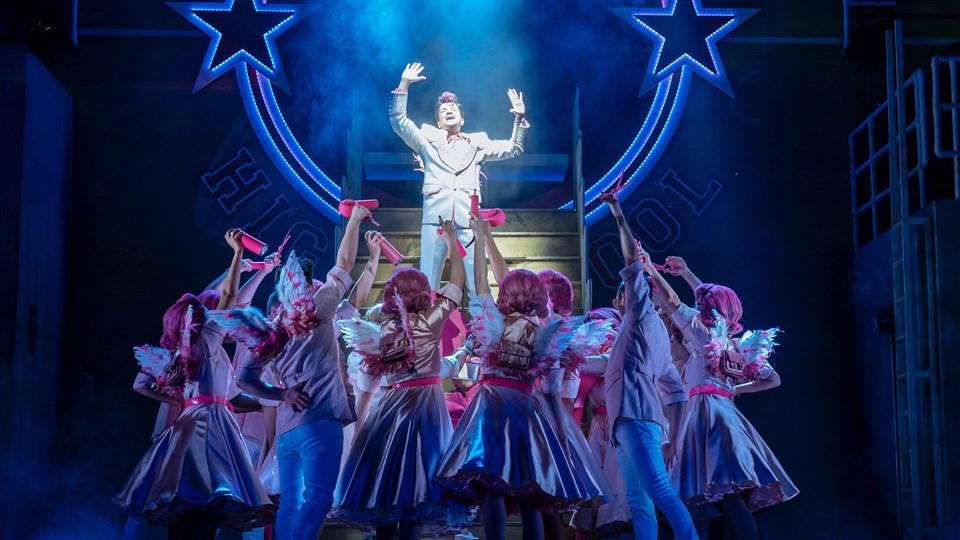 Peter Andre as Teen Angel and the cast of the 2019 UK and Ireland tour of GREASE, credit Manuel Harlan.jpg