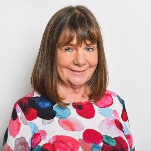 A portrait of Julia Donaldson with a grey background