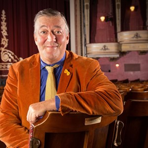 Stephen Fry sits on his dedicated seat in the Festival Theatre