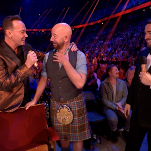 Graham Simpson surprised as Unsung Hero by Jason Manford and Craig Revel Horwood at the National Lottery’s Big Night of Musicals; photo Getty Images for The National Lottery 