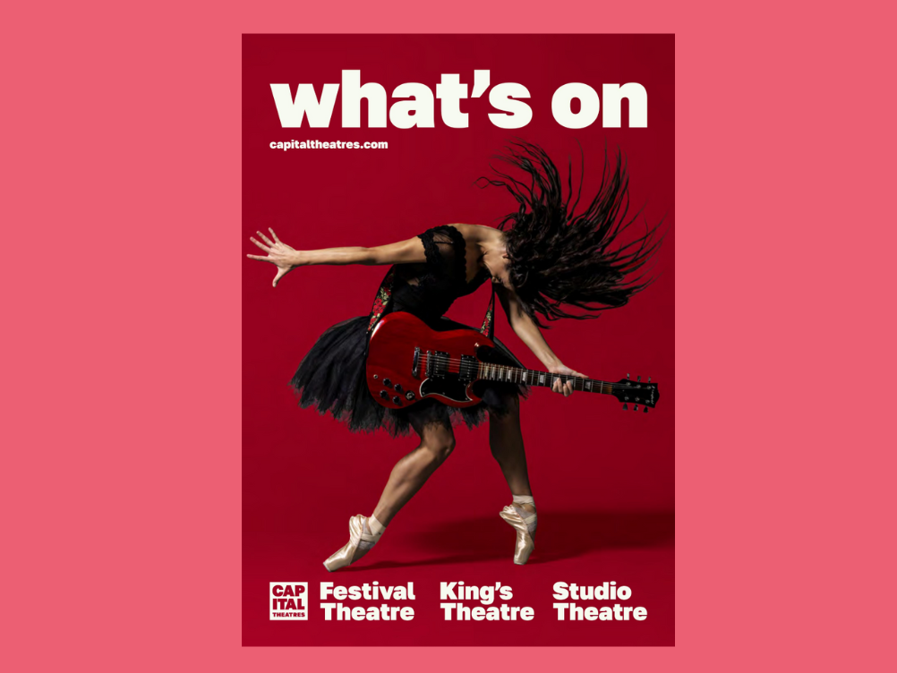 A person with long hair in a black dress plays an electric guitar energetically on a red background with "what's on" and theatre names printed above and below.